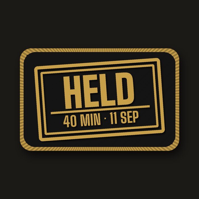 Gold border-control stamp patch: Held, 40 min, 11 Sep