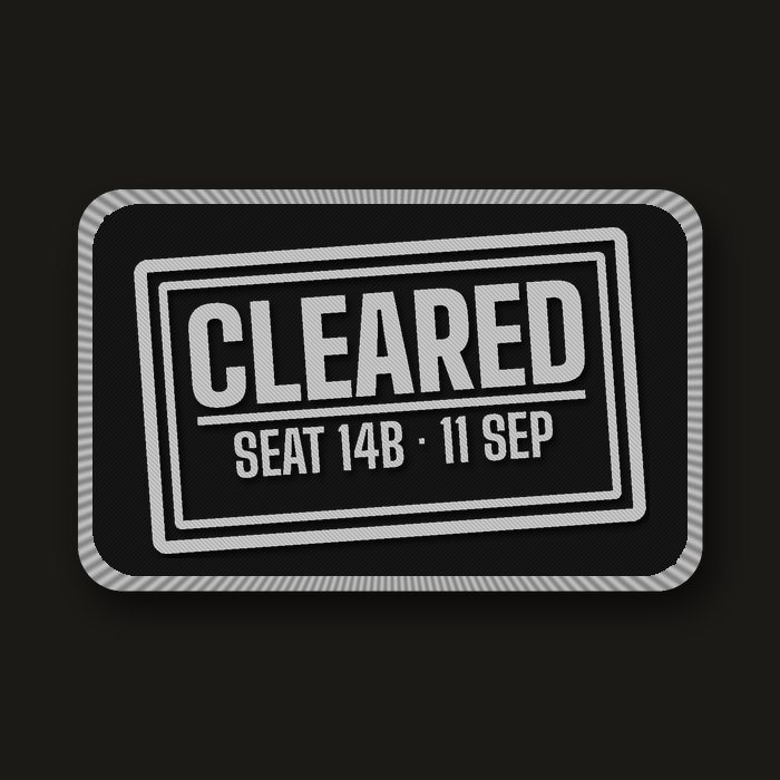 Silver border-control stamp patch: Cleared, seat 14B, 11 Sep